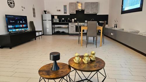a living room and kitchen with a table and chairs at AK Homes, a due passi da Orio in Azzano San Paolo