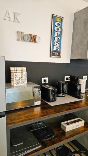 a counter with two toasters and a microwave on it at AK Homes, a due passi da Orio in Azzano San Paolo