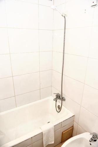 a bathroom with a bath tub and a toilet at Studio with city view and wifi at Funchal 5 km away from the beach in Funchal