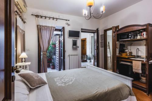 Ένα ή περισσότερα κρεβάτια σε δωμάτιο στο Dream Holiday Ortigia