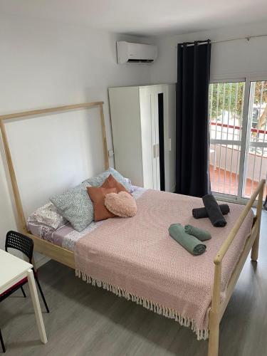Posteľ alebo postele v izbe v ubytovaní Carolina en Joan Miro