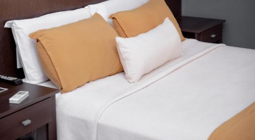 Una cama o camas en una habitación de Gran Rex Hotel