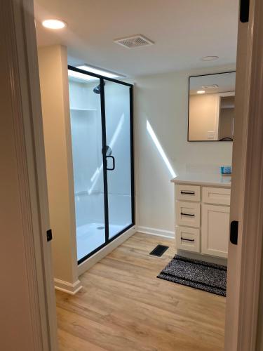 a walk in closet with a glass door at Whiskey Woods in Frankfort