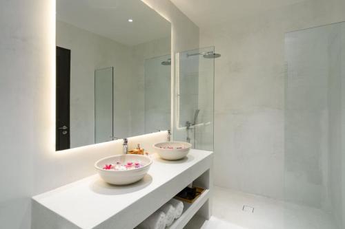 a bathroom with a sink and a mirror at VIlla Tramonto sunset seaview villa Koh Samui in Koh Samui