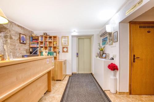 a kitchen with a counter and a refrigerator at Pansion Comfort Santa Marija in Novigrad Istria