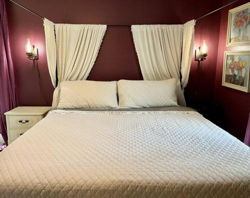 a bedroom with a large bed with two white pillows at Sanford's Seahaven in Sanford