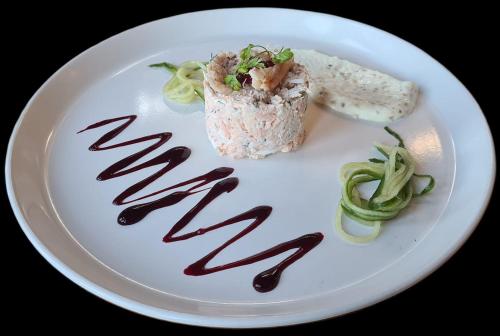 a white plate with a piece of food on it at The Manor Boutique Hotel Restaurant and Bar in Conwy