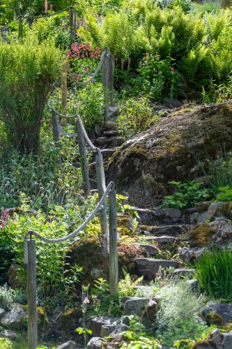 a set of stone stairs in a garden at Chalet Cinq Moutons in Orsières