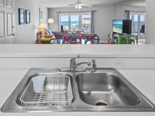 a kitchen sink with a dish drying rack in it at SC 601 - Beachfront Condo With Amazing Views! in Fort Walton Beach