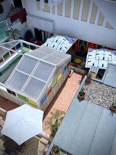 an overhead view of a building with an umbrella at Dar Lalzohra in Rabat