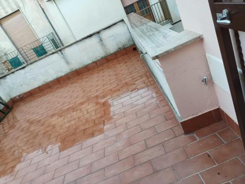 an empty brick floor in a building at Divingreta 1820 in Ottaviano