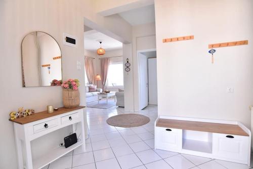 a bathroom with a sink and a mirror at Blue Memories in Kavala
