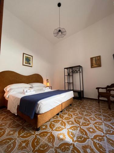 a bedroom with a large bed in a room at Vitozzi Suite in Orvieto
