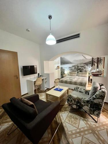 a living room with a couch and a bed at Garni Hotel TIANIS in Kotor