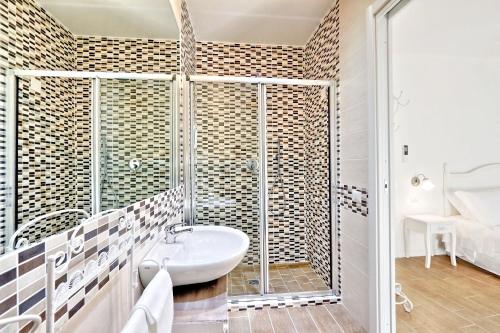 a bathroom with a sink and a shower at Prime Vatican Garden in Rome