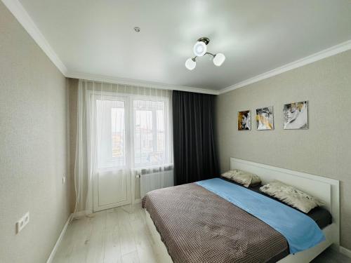 MoD Standard 2-Room Apartments tesisinde bir odada yatak veya yataklar
