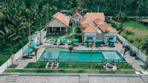 an aerial view of a house with a swimming pool at Rejuvenate Resort and Restaurant in Jembrana