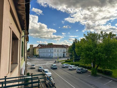 a view of a street with cars parked on the road at 3 - room Masaryk A 100m2 City Centrum Kosice in Košice