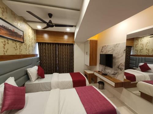 Ένα ή περισσότερα κρεβάτια σε δωμάτιο στο Hotel RK ICON
