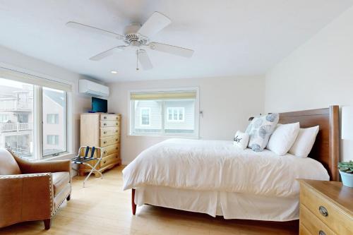 En eller flere senge i et værelse på Family Beach Retreat