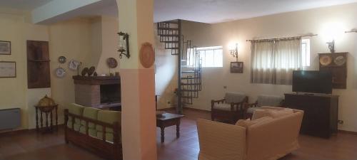 a living room with a couch and a dining room at Il Borghetto in Todi