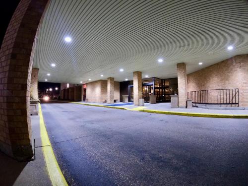an empty building with an empty parking lot at Hotel Mead Resorts & Conventions Center in Wisconsin Rapids