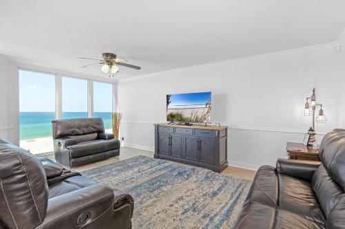 a living room with a couch and chairs and the ocean at FL-Seaspray Perdido Key 605 condo in Pensacola