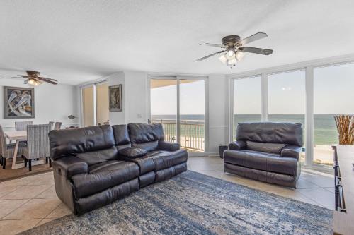 a living room with two leather chairs and a couch at FL-Seaspray Perdido Key 605 condo in Pensacola