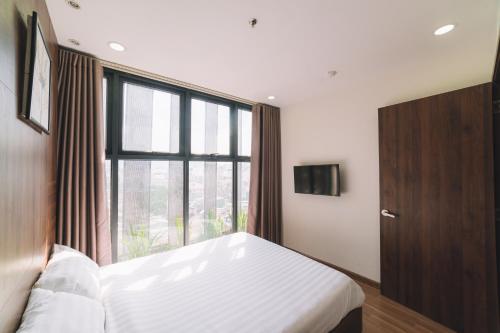 Katil atau katil-katil dalam bilik di Dalat Center Residence