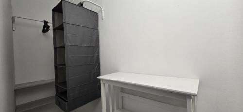 a bathroom with a white counter and a shelf at The white cave- Bluchalet in Riomaggiore