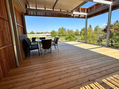a large deck with a table and chairs on it at Paradies in Bad Radkersburg