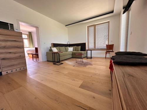 a living room with a couch and a table at Paradies in Bad Radkersburg