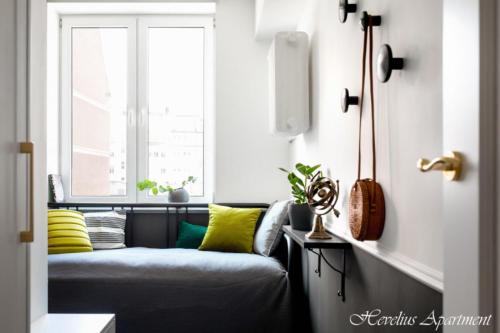 a living room with a couch and a window at Bayside Apartments in Gdańsk