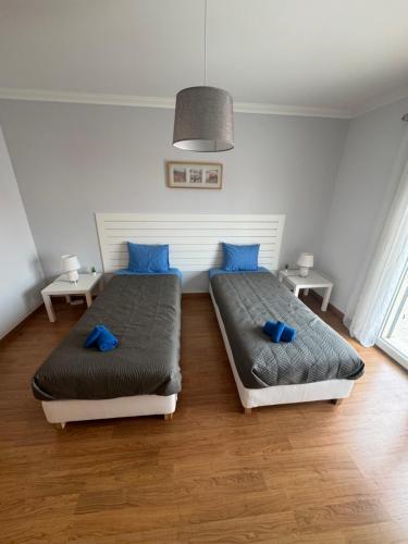 Säng eller sängar i ett rum på Sunny baleal guesthouse