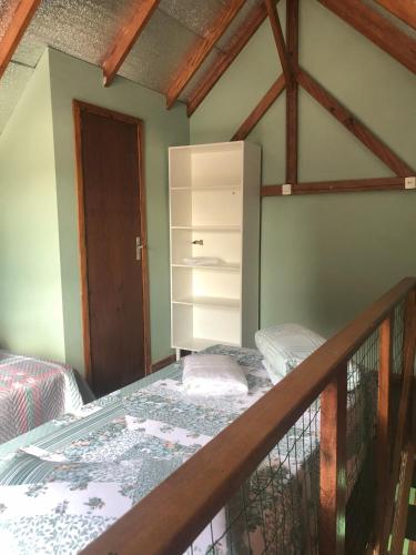 Ένα ή περισσότερα κρεβάτια σε δωμάτιο στο Cabanas São Miguel