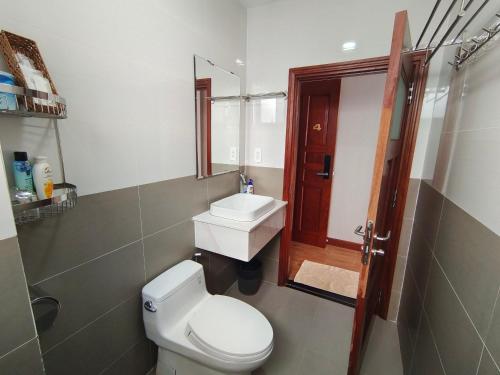 a bathroom with a toilet and a sink at Sealight Villa and House Phu Quoc in Phu Quoc