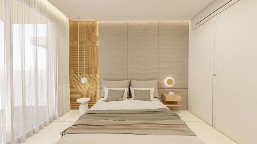 1 dormitorio con 1 cama grande y paredes blancas en SANTA MARINA RESORT, en Glífa