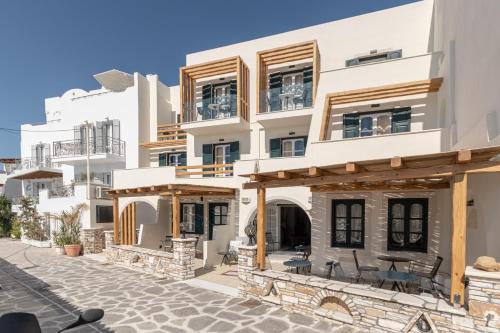 a large white building with wooden beams at Hotel Palatia in Naxos Chora
