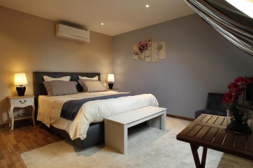 Posteľ alebo postele v izbe v ubytovaní La Cense - Ferme des Tilleuls