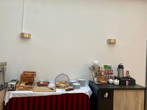 a table with a table with food on it at Trip Inn Hotel Düsseldorf Neuss in Neuss