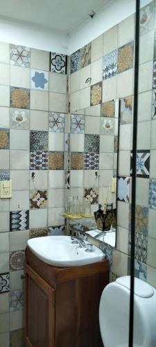 a bathroom with a sink and a toilet at Cunumí in Puerto Iguazú