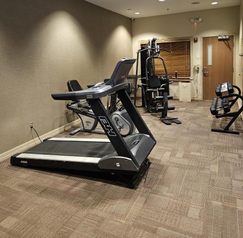 a gym with a treadmill and two tread machines at Comfort Inn & Suites Donna near I-2 in Donna