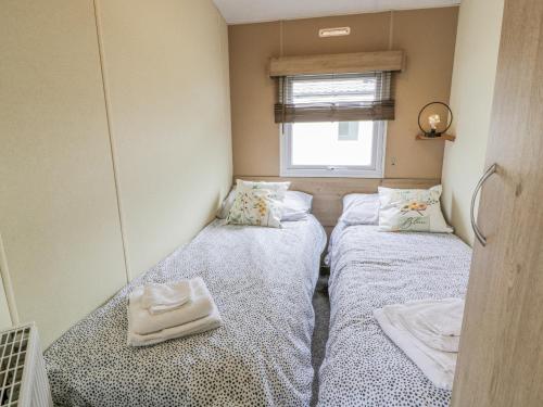 Ένα ή περισσότερα κρεβάτια σε δωμάτιο στο Middlemuir Retreat