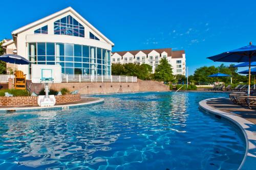 a swimming pool in front of a building at Hyatt Regency Chesapeake Bay Golf Resort, Spa & Marina in Cambridge