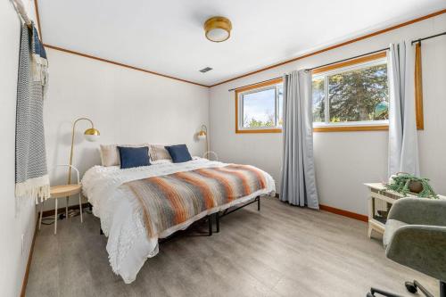 a bedroom with a bed and a window at Field of Dreams in Picton