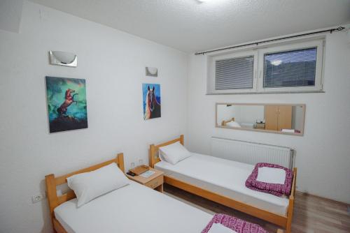 Postel nebo postele na pokoji v ubytování Hotel Kiko