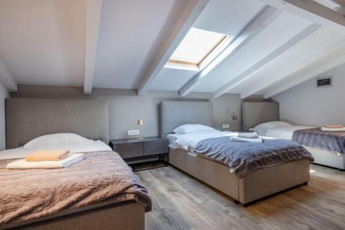 Postel nebo postele na pokoji v ubytování Villa Melody, a luxurious Holiday Retreat