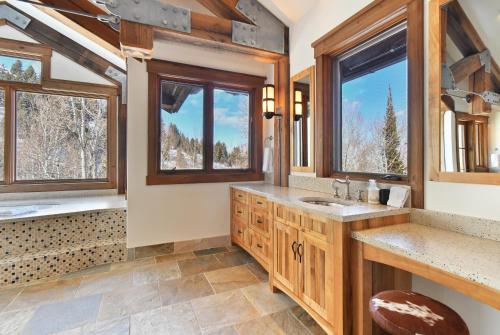 A bathroom at Ski in out Mountain Estate in The Colony w Hot Tub, Theater, Game Room