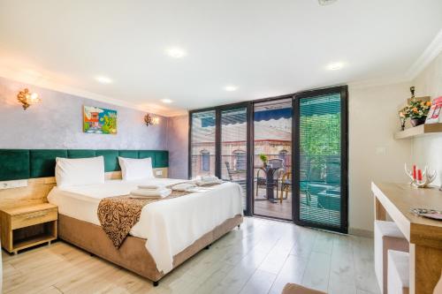 Ένα ή περισσότερα κρεβάτια σε δωμάτιο στο Loren Hotel&Suites
