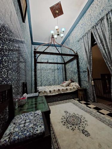 a bedroom with a bed with a cage in it at Dar Si hmed in Rabat